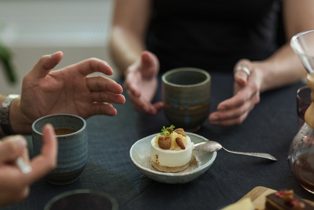 Couple Drinking Coffee and Having a Conversation